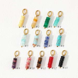 May include: Thirteen individual jewelry charms, each featuring a gold-toned metal jump ring attached to a vertical stack of four small cylindrical beads. The beads vary in color and texture, including yellow, green, blue, turquoise, pink, brown, red, and black, labeled #1 through #13.