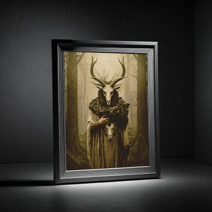 May include: Framed artwork featuring a figure with a deer skull mask and antlers, clad in a long robe, holding another skull. The artwork has a dark, forest-like background with muted tones, and is set in a black frame.
