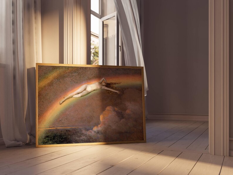 May include: A framed artwork featuring a nude figure floating through a rainbow. The painting has a warm color palette with a gold frame. The artwork is leaning against a wooden floor in a room with natural light.