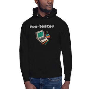 May include: Black hooded sweatshirt with the text "Pen-tester" in white. A retro-style laptop with colorful pencils is printed on the front.