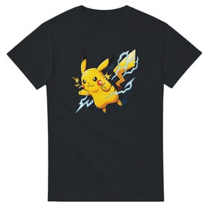 May include: A black short-sleeved t-shirt featuring a graphic print of a yellow Pikachu character with red cheeks, pointed ears with black tips, and a lightning bolt tail, surrounded by blue and white lightning bolts emanating from its body.