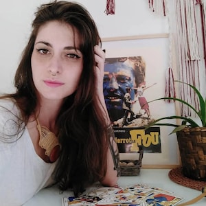 Professional tarot reader at desk with tarot spread, intuitive psychic reading atmosphere, personal tarot session