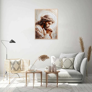 May include: A painting of Jesus Christ with a crown of thorns, praying with his hands clasped together. The painting is in a wooden frame and is hanging on a white wall.