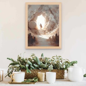 Puede incluir: Una pintura enmarcada que representa una escena religiosa con una figura con una t&uacute;nica blanca saliendo de una cueva con una gran piedra rodada. La cueva est&aacute; iluminada por una luz brillante, y hay figuras en el fondo.