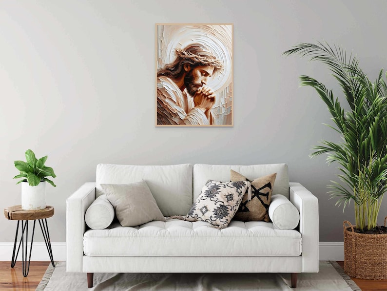 May include: A painting of a man with a crown of thorns, praying with his hands clasped together. The painting is in a light brown frame and has a white background.