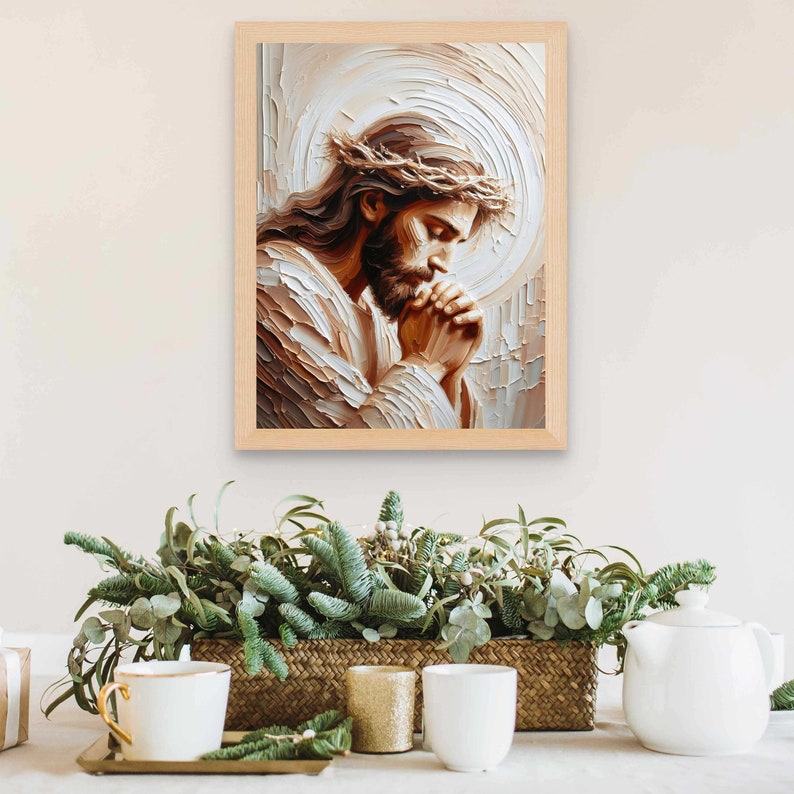 May include: A framed painting of a man with a crown of thorns, praying with his hands clasped together. The painting is done in a painterly style with thick brushstrokes and warm colors.