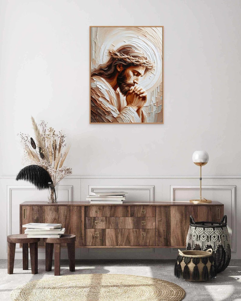 May include: A painting of Jesus Christ with a crown of thorns, praying with his hands clasped together. The painting is done in a painterly style with a light brown and white color palette.