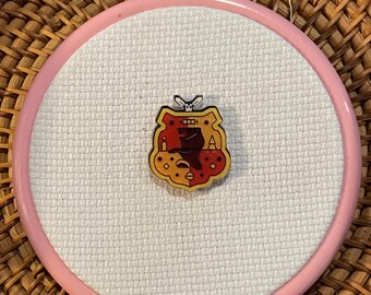 Sujetador de agujas de acrílico con escudo de la casa Gryffindor para bordado/punto de cruz