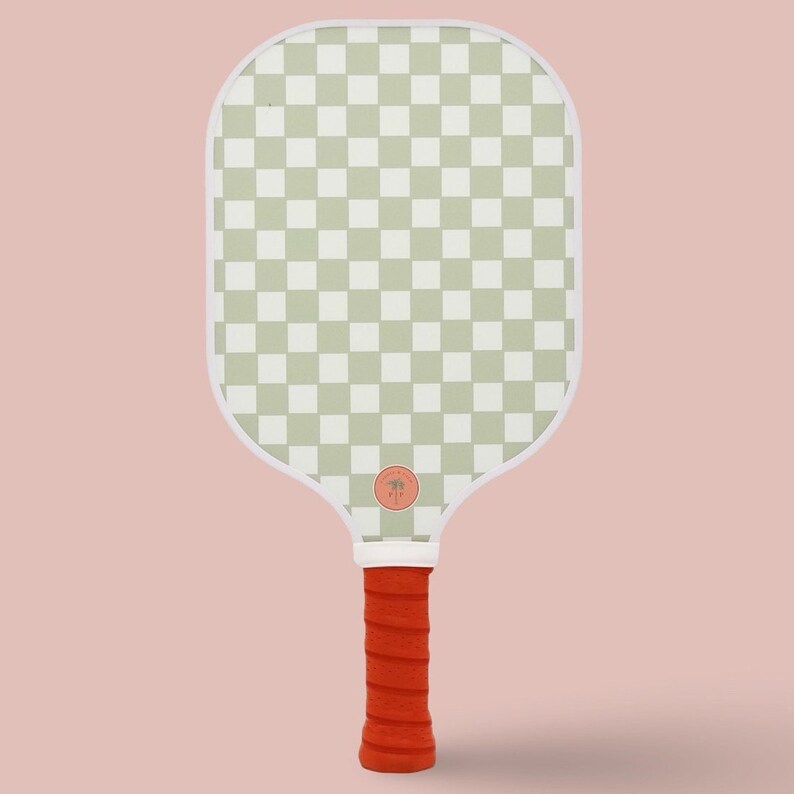 One side of a pickleball paddle, featuring a checkerboard pattern