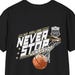 May include: A black short-sleeve t-shirt featuring a graphic of a basketball going through a hoop. The text reads NO FAILURE NEVER STOP JUMP SHOT with a small shield emblem containing the number 23 and the letters USA above the hoop.