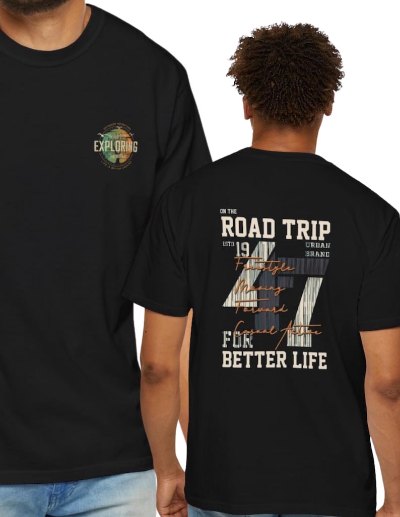 May include: A black t-shirt featuring a small circular graphic on the front chest with the text EXPLORING. The back displays a large graphic with the text ON THE ROAD TRIP ESTD 1947 URBAN BRAND MOVING FORWARD CASUAL ACTIVE FOR BETTER LIFE.