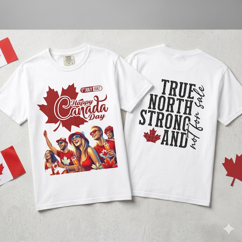 May include: White t-shirts with Canada Day graphics. One shirt features a red maple leaf with the text "Happy Canada Day" and a graphic of people celebrating. The other shirt has the text "True North Strong and" with a maple leaf.