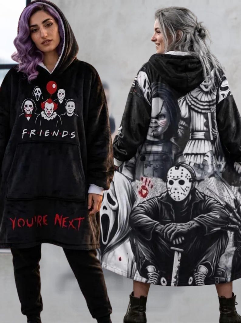 May include: A black oversized hooded sweatshirt featuring a front graphic of horror movie characters with the text FRIENDS and YOU'RE NEXT in red. The back displays a large, detailed black and white collage of iconic horror film villains.