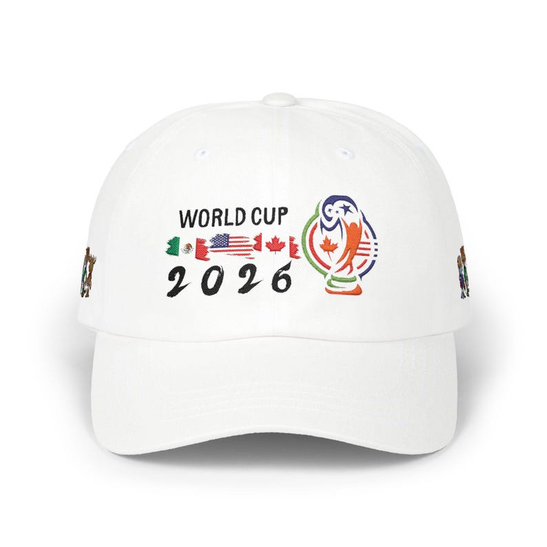 May include: White baseball cap featuring the text "WORLD CUP 2026" with flags of Mexico, the United States, and Canada. The cap also displays a colorful graphic of the World Cup trophy.