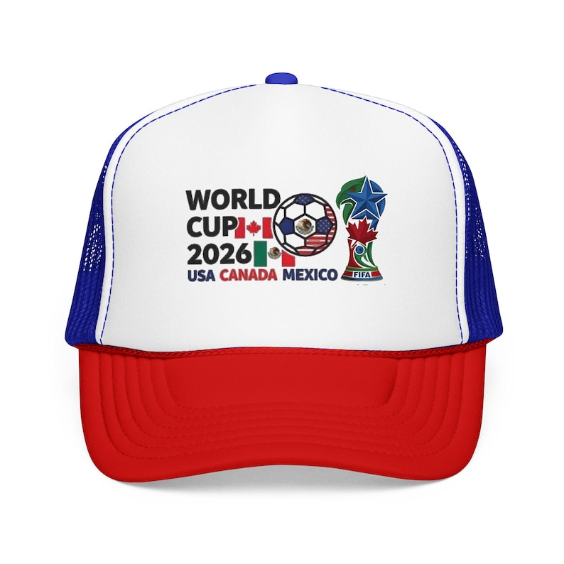 May include: A red, white, and blue trucker hat featuring the text "WORLD CUP 2026 USA CANADA MEXICO" and a soccer ball design. The hat has a white front panel, a red brim, and a blue mesh back.