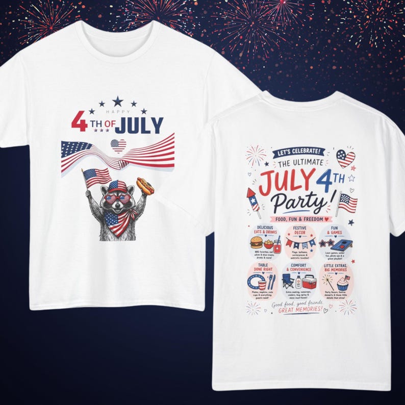 May include: White t-shirts with patriotic designs. One shirt features a raccoon wearing sunglasses and holding a hot dog and American flag, with "4th of July" text. The other shirt has "July 4th Party!" text and icons.