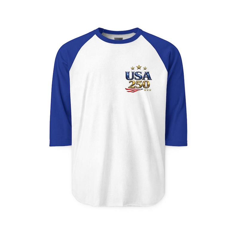 May include: A white baseball-style shirt with blue sleeves. The shirt features the text "USA 250" with stars and stripes graphic on the front. The shirt has a crew neck and three-quarter length sleeves.