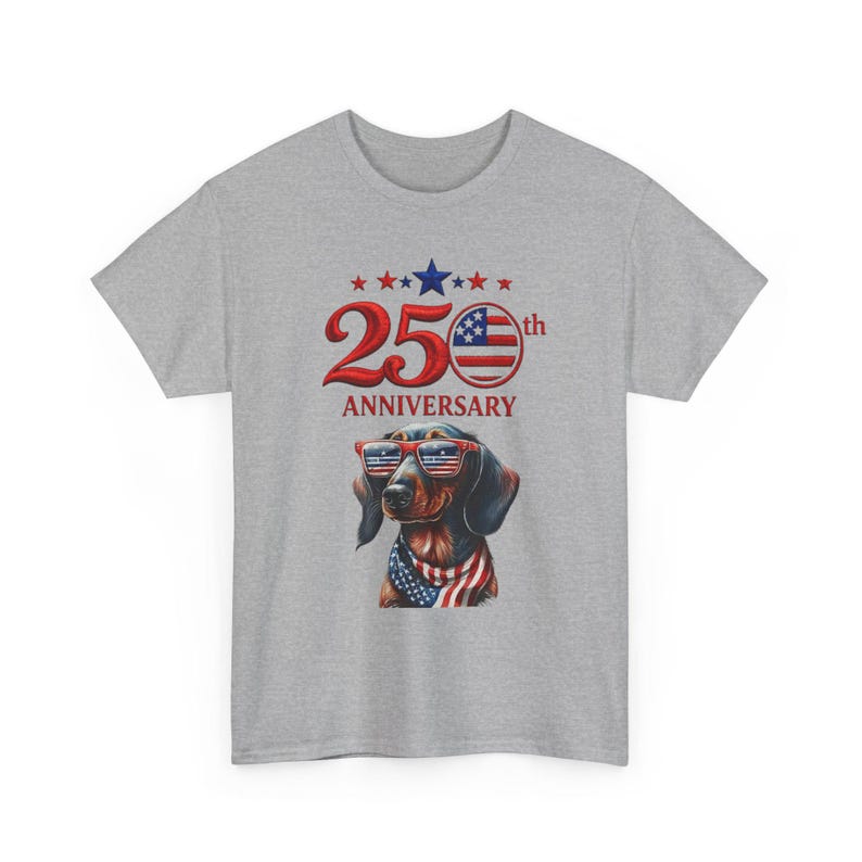 May include: A gray t-shirt featuring a dachshund wearing sunglasses and a patriotic bandana. The shirt has the text "25th Anniversary" with stars and a red, white, and blue design.