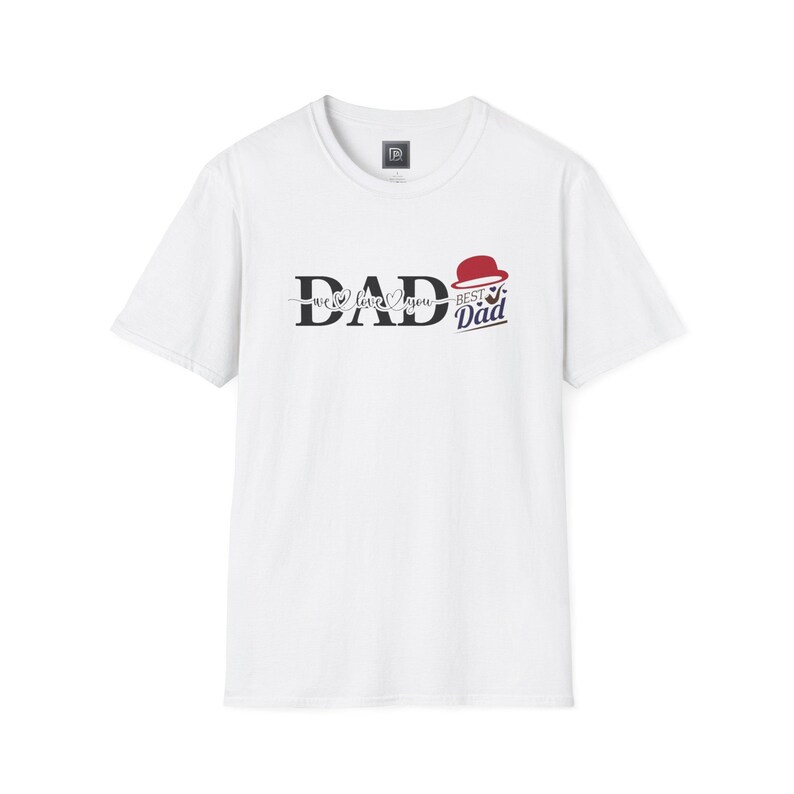 May include: White t-shirt with the word "DAD" in a stylized font, with "we love you" underneath. A red hat graphic and the words "Best Dad" are to the right in a navy blue font. The shirt is a crew neck.