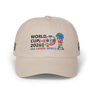 May include: Light blue baseball cap with the text "WORLD CUP 2026 USA CANADA MEXICO" and a soccer ball graphic. The cap also features the FIFA logo and flags of the USA, Canada, and Mexico.