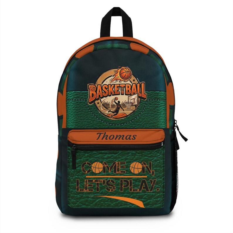 May include: A backpack featuring a basketball theme with a green textured background and orange accents. The front displays a basketball graphic, the text "BASKETBALL", the name "Thomas", and the phrase "COME ON, LET'S PLAY." with basketball icons.