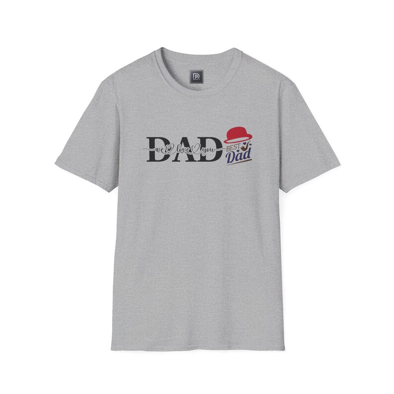 May include: A heather gray t-shirt with the word "DAD" in a bold, stylized font. The text "we love you" is below the word "DAD". The words "Best Dad" are below the word "DAD", with a red hat graphic.