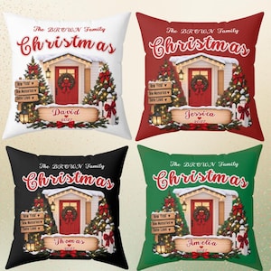 May include: Four square throw pillows in white, red, black, and green featuring a house with a red door, Christmas trees, and a wreath. Text reads The BROWN Family Christmas, New Year, New Memories, Same Love, and names like David.