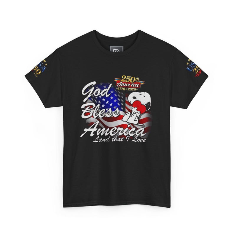 May include: Black t-shirt featuring a graphic of the American flag with the text "God Bless America Land that I Love." Snoopy is holding a heart. The shirt also has "250th America 1776-2026" text.