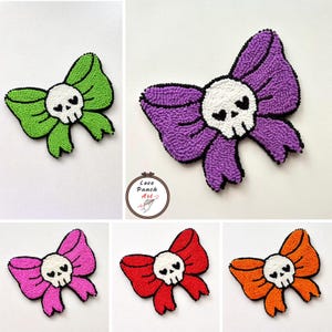 May include: A selection of handmade bow patches, each with a skull motif. The bows are in shades of green, purple, pink, red, and orange, with black edging. The central skull design is white. The text "Love Punch Art" is in a circular logo.