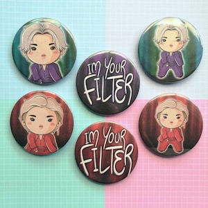 May include: Six round, colorful buttons with cartoon characters and the text "I'm Your Filter" on two of the buttons.