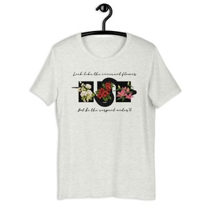 May include: A heather grey t-shirt with a black graphic of a snake wrapped around flowers. The text "Look like the innocent flower but be the serpent under't" is printed on the shirt.