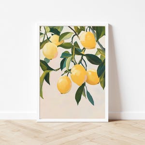 May include: A framed art print featuring a vibrant illustration of lemons on a branch. The lemons are a bright yellow, contrasted by the dark green leaves. The artwork is set against a soft, neutral background, creating a fresh and inviting aesthetic.