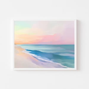 Peut inclure: Une impression d'art encadrée représentant une scène de plage sereine. L'œuvre présente une palette de couleurs pastel avec des nuances de rose, de bleu et de jaune. Les vagues de l'océan rencontrent doucement le rivage sablonneux sous un ciel coloré.