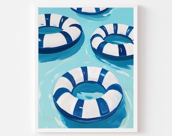 May include: A framed art print featuring four blue and white striped life preservers floating in a light blue pool. The painting has a bright, summery feel, with the life rings arranged in a playful composition.