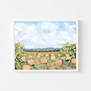 May include: A framed painting depicts a pumpkin patch under a blue sky with fluffy white clouds. The pumpkins are orange, and the leaves are green. The background shows a field and distant mountains.