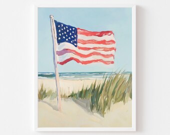 May include: An American flag waves in the wind on a sandy beach. The painting depicts the flag with red and white stripes and a blue field of stars. Tall green grass and the ocean are in the background.