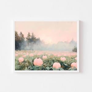 May include: A painting of a field of pink pumpkins in a foggy forest at sunrise. The pumpkins are scattered throughout the field, with some in the foreground and others in the background. The forest is in the distance, with trees silhouetted against the sky. The sky is a soft pink and orange, with a hint of blue.