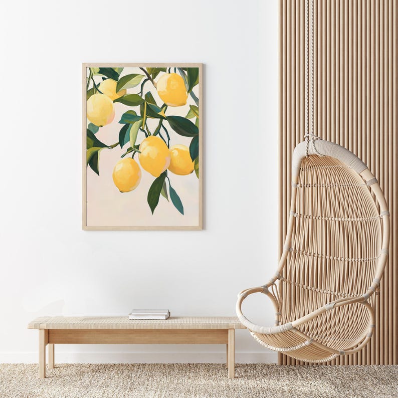 May include: A framed art print featuring a vibrant illustration of lemons on a branch with green leaves. The artwork has a light background and is displayed above a wooden bench. A woven hanging chair is also visible.