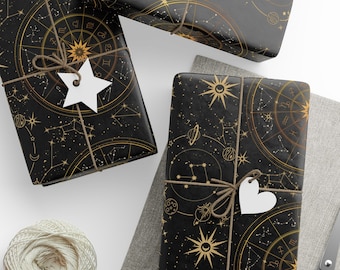 Papel de regalo celestial: Papel de regalo astrológico negro y dorado