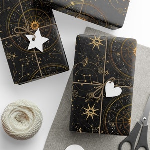 Papel de regalo celestial: Papel de regalo astrológico negro y dorado