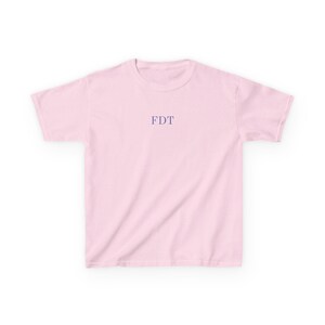 Light pink FDT baby tee with subtle anti Trump text. Feminist baby tee and progressive t-shirt, perfect liberal gift for her.
