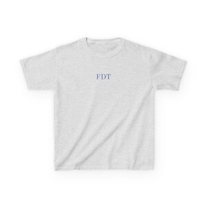 Ash grey anti Trump baby tee with minimalist FDT text. Feminist political tshirt for women, ideal gift for activist or liberal.