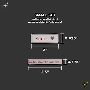 May include: Two small, white vinyl stickers with pink text and a pink heart. The top sticker reads "Kudos" and measures 2 inches wide by 0.625 inches tall. The bottom sticker reads "You have already left kudos here. :)" and measures 2.5 inches wide by 0.375 inches tall.
