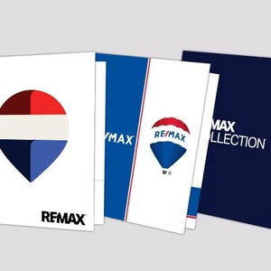 May include: Three presentation folders featuring RE/MAX branding. The first is white with a red, white, and blue balloon icon and RE/MAX text. The second is blue and white with a balloon logo. The third is dark blue with the text RE/MAX COLLECTION.