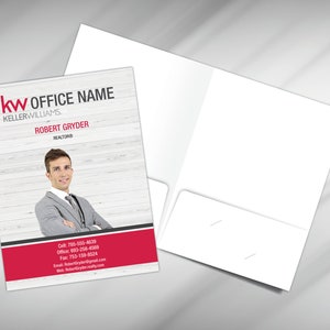 May include: A red and white real estate business card with the text "KW OFFICE NAME KELLERWILLIAMS." and "ROBERT GRYDER REALTORS®". A man in a gray suit is pictured in the background.