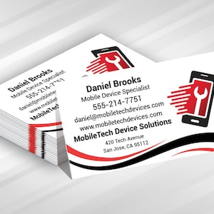 May include: A stack of white business cards featuring a black and red logo of a smartphone with a wrench icon. The text reads Daniel Brooks, Mobile Device Specialist, 555-214-7751, daniel@mobiletechdevices.com, www.mobiletechdevices.com, MobileTech Device Solutions.
