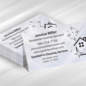 May include: A stack of white business cards with the name "Jessica Miller" and "Residential Cleaning Specialist" printed in black. The cards also display contact information and a logo of a house with sparkles.
