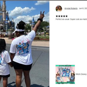 a couple of people that are standing in front of a castle