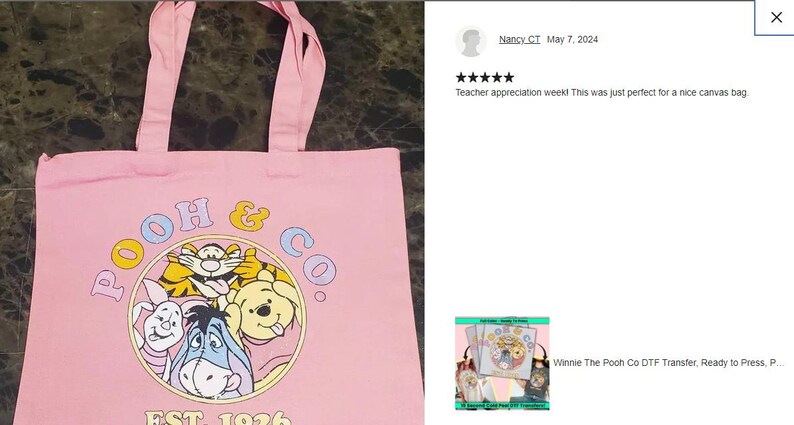 a pink tote bag with a picture of winnie the pooh on it
