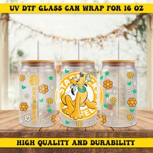 May include: Three 16 ounce glass can wraps with a clear background and a colorful design. The center wrap features a cartoon dog with a bone in its mouth. The dog is surrounded by a yellow circle with the text "STARBUCKS COFFEE". The other two wraps feature a pattern of yellow flowers, green peace signs, and white hearts.